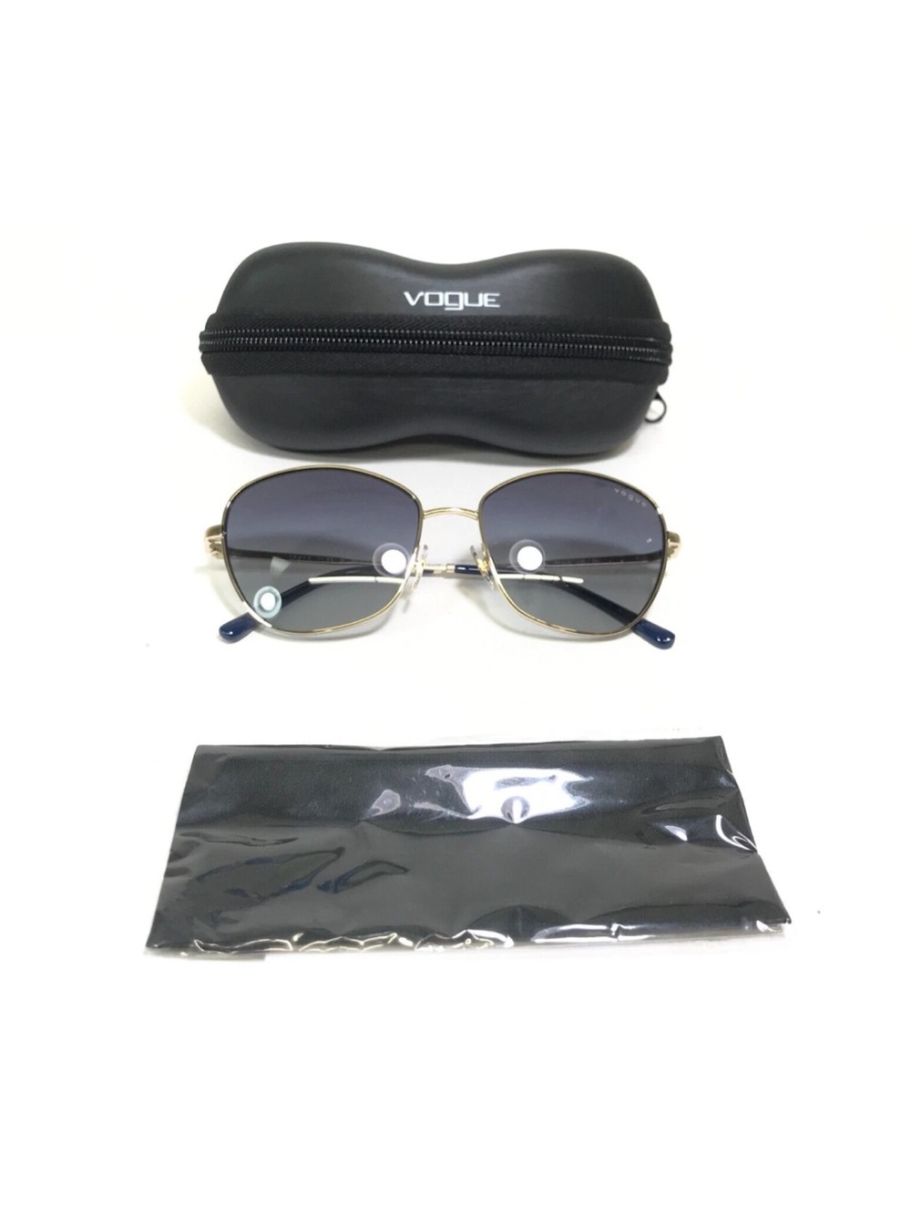 Vogue women’s Gold Frame Sunglasses with dark blue  Gradient Lenses